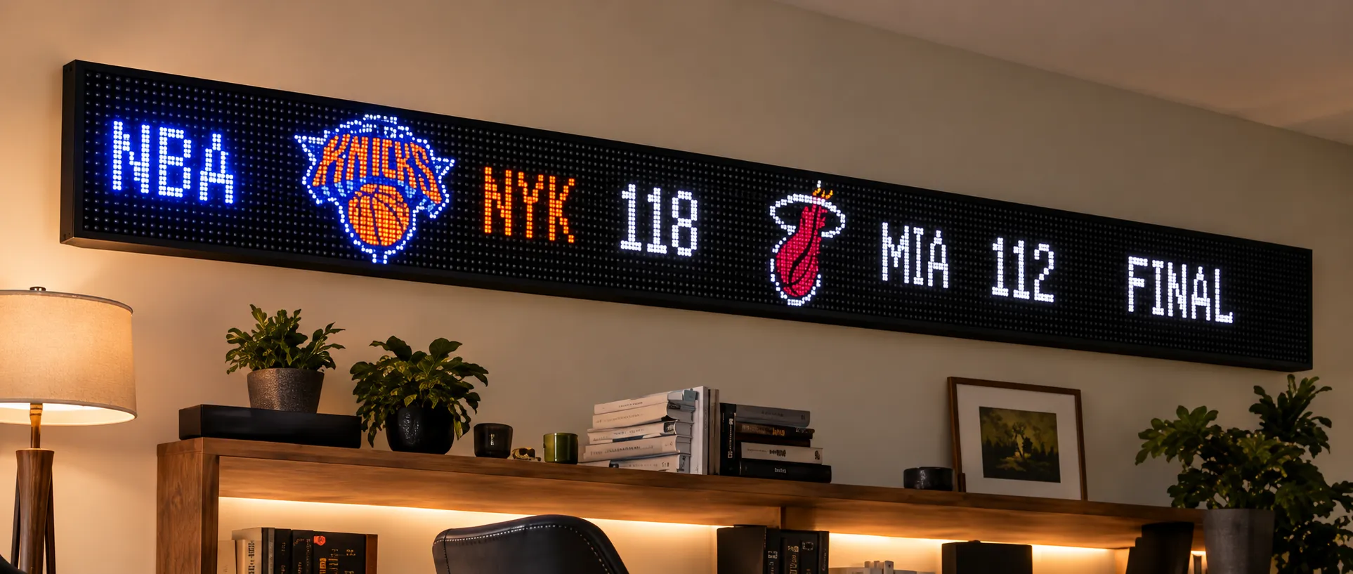 Illustrative interior with sports scores on an LED sign; sample content